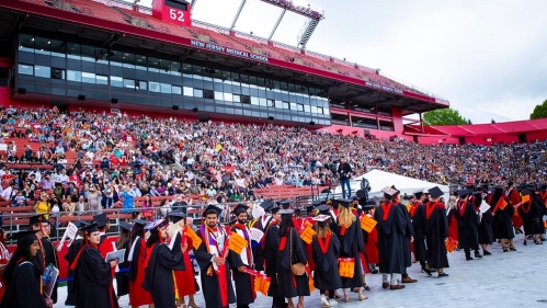 happy grads in the crowded stadium