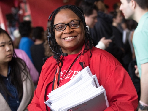 female volunteer with books in her hand