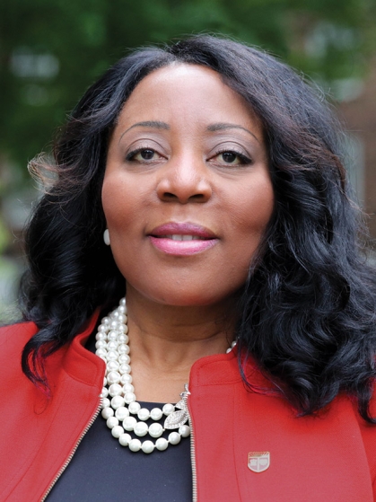 Francine Conway, red jacket, black shirt, three strand pearl necklace