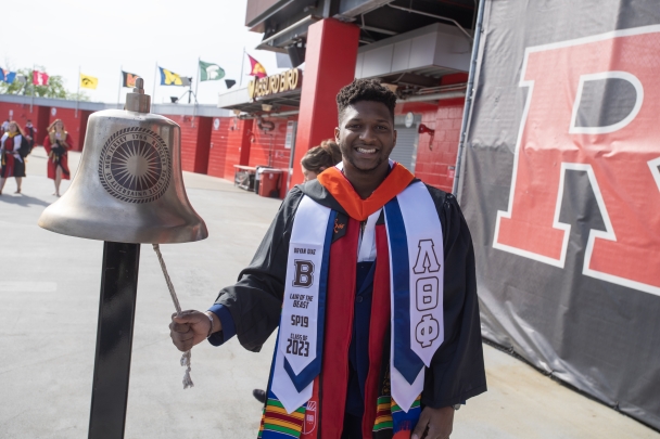 Student Ringing Bell at Commencement